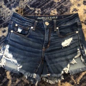 Next level strength dark wash ripped shorts